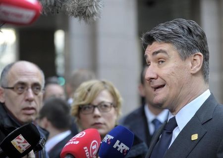 © Reuters. Croatia's PM Milanovic speaks to the media upon arriving at a European Union leaders summit at the EU council headquarters in Brussels