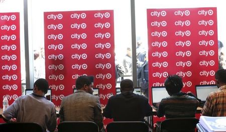 © Reuters. Job seekers work on computers while applying for the 300 available positions at a new Target retail store in San Francisco