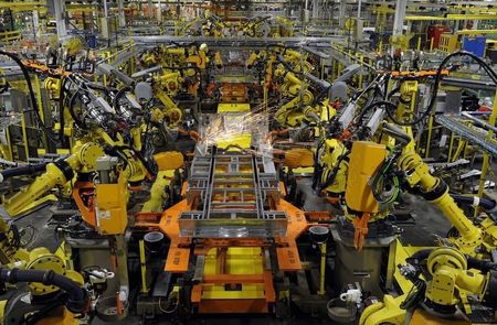 © Reuters. Robotic arms spot welds on the chassis of a Ford Transit Van under assembly at the Ford Claycomo Assembly Plant in Claycomo