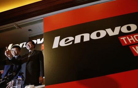 © Reuters. Lenovo Chairman and CEO Yang gestures beside CFO Wong during a news conference in Hong Kong