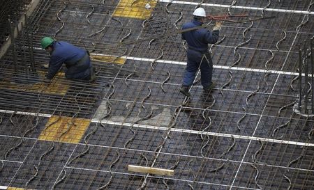 © Reuters. Construction workers are pictured on a large construction site in downtown Frankfurt