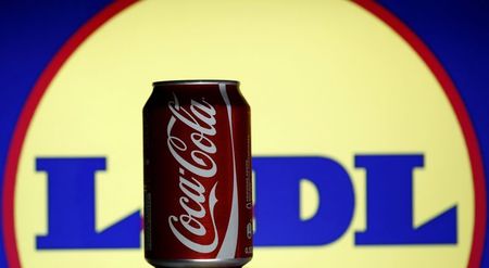 © Reuters. A can of Coca-Cola is seen in front of the Lidl logo in this photo illustration taken in Sarajevo