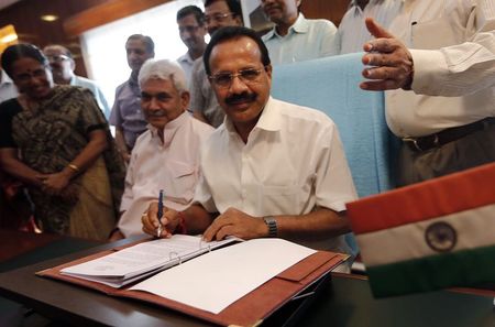 © Reuters. India's RM Gowda poses after giving the final touches to the railway budget for the 2014/15 fiscal year in New Delhi