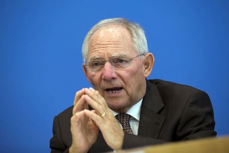 © Reuters. German Finance Minister Schaeuble presents 2015 federal budget draft during news conference in Berlin