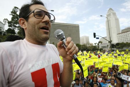 © Reuters. American Apparel owner Dov Charney speaks during a May Day rally protest march for immigrant rights, in downtown Los Angeles