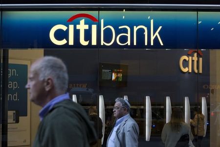 © Reuters. People walk past a Citibank branch in New York