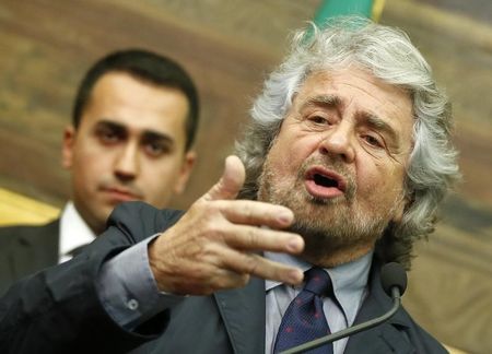 © Reuters. Leader of  the 5-Star movement and comedian Beppe Grillo talks to reporters at the end of consultations with Italian Prime Minister-designate Matteo Renzi at the Parliament in Rome