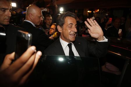 © Reuters. Former French President Nicolas Sarkozy leaves a restaurant in Paris