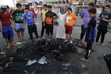 © Reuters. الدولة الاسلامية تعلن مسؤوليتها عن هجومين انتحاريين قتلا تسعة في بغداد