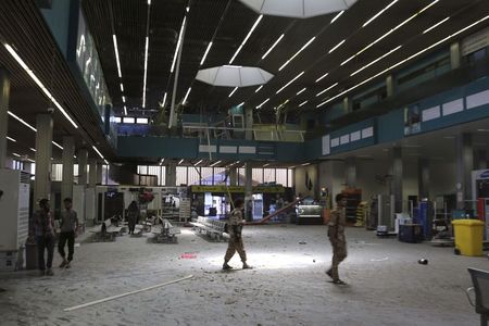 © Reuters. The inside of a damaged terminal is seen after a shelling at Tripoli International Airport
