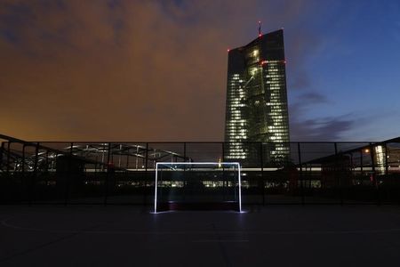 © Reuters. A photograph taken using long exposure shows a goalpost which has been illuminated with torches at a leisure facility in front of the ECB headquarters in Frankfurt