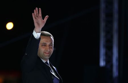 © Reuters. Georgia's PM Garibashvili greets people during celebrations for the signing of an association agreement with the EU in Tbilisi