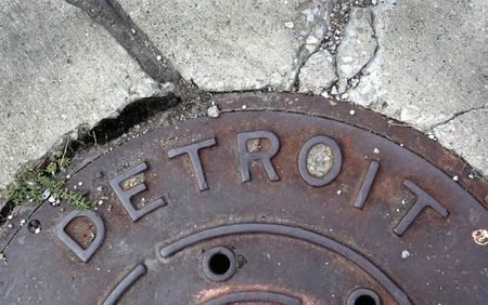 © Reuters. 'Detroit' is seen on the top of an iron man-hole cover on a street in Detroit
