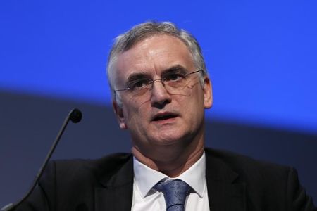 © Reuters. Bank of England's Executive Director for Markets Paul Fisher speaks during the World Islamic Economic Forum in London