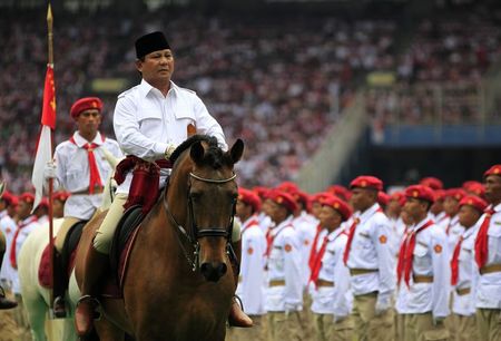 © Reuters. File photo of Prabowo riding a horse during a campaign rally in Jakarta