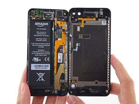 © Reuters. An Amazon Fire smartphone is seen opened up during a teardown procedure in a handout picture provided by iFixit