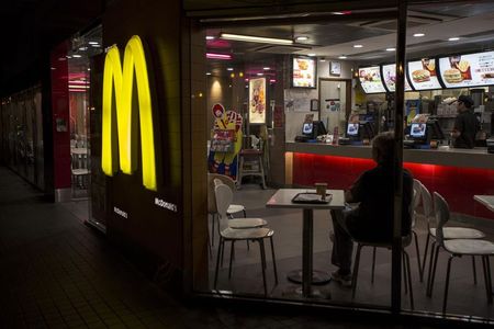 © Reuters. A customer is seen through the windows of a McDonald's store in Hong Kong