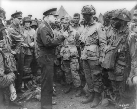 © Reuters. Handout photo of Allied forces Supreme Commander General Eisenhower speaking with U.S. Army paratroopers at Greenham Common Airfield in England