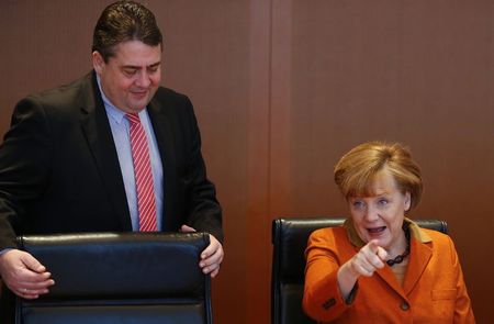 © Reuters. File photo of German Chancellor Merkel and Economy Minister Gabriel arriving for the weekly cabinet meeting in Berlin