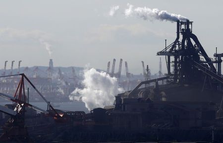 © Reuters. File photo of smoke rising from factories at Keihin industrial zone in Kawasaki