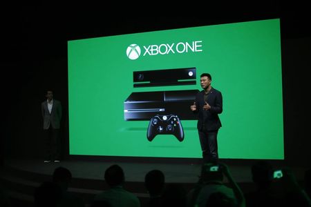 © Reuters. Xie, general manager of management and operations of Microsoft in China, speaks during the presentation of the Xbox One by Microsoft as part of ChinaJoy 2014 in Shanghai