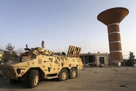 © Reuters. An armoured vehicle is seen after fighting between Libyan special forces and ex-rebel fighters of the Benghazi Shura Council in Benghazi