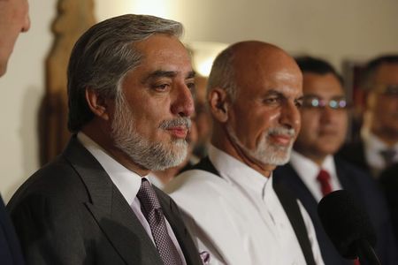 © Reuters. Afghanistan's presidential candidate Abdullah addresses a news conference with rival Ghani as they announced a deal for the auditing of all Afghan election votes at the United Nations Compound in Kabul