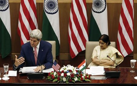 © Reuters. U.S. Secretary of State Kerry addresses the media as India's External Affairs Minister Swaraj looks on during their joint news conference New Delhi