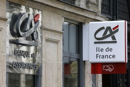 © Reuters. Logos are seen on a Credit Agricole branch in Paris