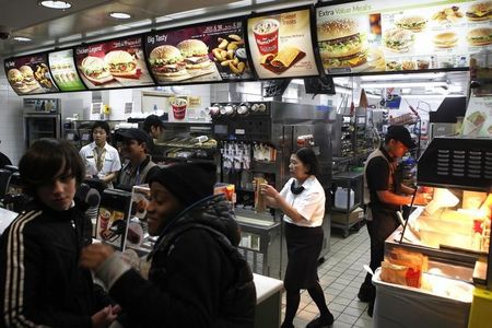 © Reuters. Customers are served at a Macdonald's fast food restaurant in London