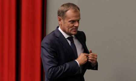 © Reuters. Poland's Prime Minister Donald Tusk walks after voting at parliament in Warsaw