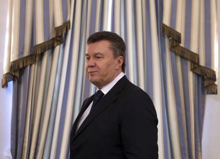 © Reuters. File photo of then Ukrainian President Yanukovich arriving to sign an EU-mediated peace deal with opposition leaders in Kiev