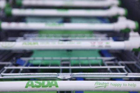© Reuters. Trolleys are lined up outside an ASDA supermarket in London