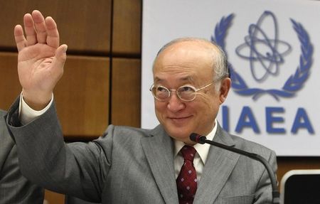 © Reuters. IAEA Director General Amano waves as he arrives for a board of governors meeting at the IAEA headquarters in Vienna