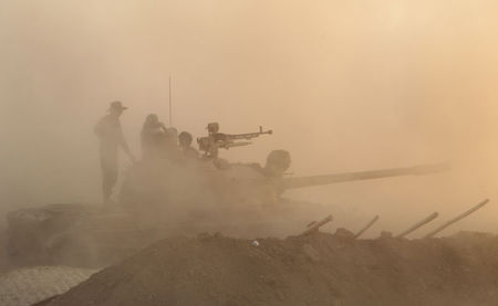 © Reuters. AVANCÉE DES PESHMERGA VERS MOSSOUL AVEC L'APPUI DE FRAPPES AMÉRICAINES