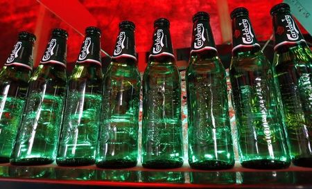 © Reuters. Bottles of Carlsberg beer are seen in a bar in St. Petersburg