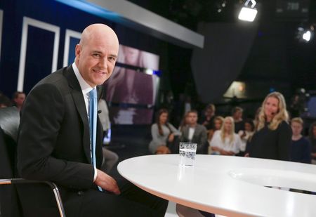 © Reuters. Sweden's Prime Minister Fredrik Reinfeldt of the Moderate Party poses in the studio during a break at his hearing in the Swedish broadcasting company SVT in Stockholm