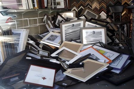 © Reuters. Fallen picture frames are seen inside a store after an earthquake in Napa, California