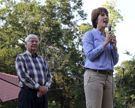 © Reuters. Handout of Gwen Graham with father, former Florida state senator and governor Bob Graham, speaking to supporters at rally in Miccosukee