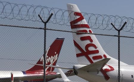 © Reuters. Virgin planes are parked next to each other at Kingsford Smith airport in Sydney