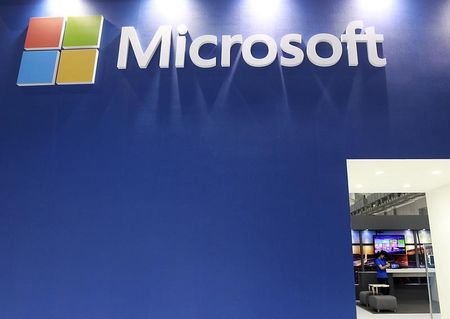 © Reuters. A employee stands in the Microsoft booth during the 2014 Computex exhibition at the TWTC Nangang exhibition hall in Taipei