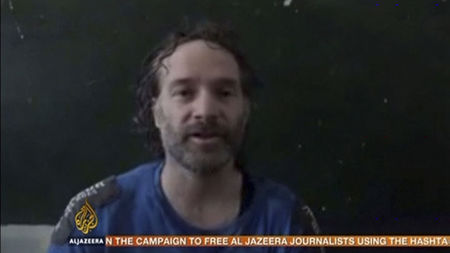 © Reuters. Still frame taken from video shows U.S. journalist Peter Theo Curtis, who has been freed by kidnappers in Syria