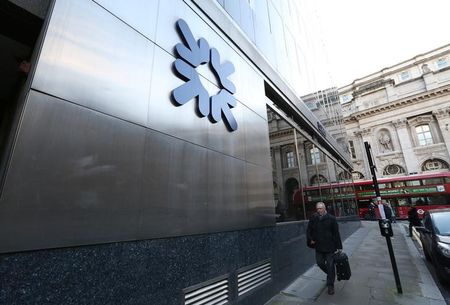 © Reuters. A man walks past a Royal Bank of Scotland building in central London