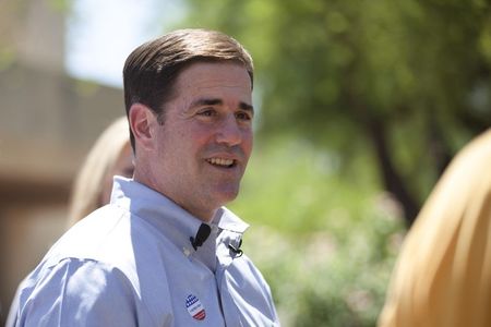 © Reuters. Ducey smiles after voting in Paradise Valley, Phoenix