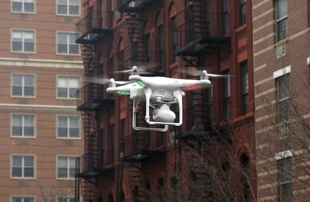 © Reuters. Camera drone flown by Wilson flies near the scene where two buildings were destroyed in an explosion, in the East Harlem section in New York City