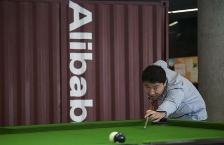 © Reuters. A man plays snooker in a hall inside Alibaba's headquarters in Hangzhou