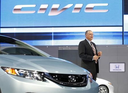 © Reuters. St. Cyr, Vice President Product Planning and Logistics American Honda Motor Co., speaks about the 2013 Honda Civic at the 2012 Los Angeles Auto Show in Los Angeles