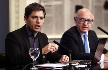 © Reuters. Argentina's Economy Minister Kicillof speaks next to Foreign Minister Timerman during a news conference in Buenos Aires
