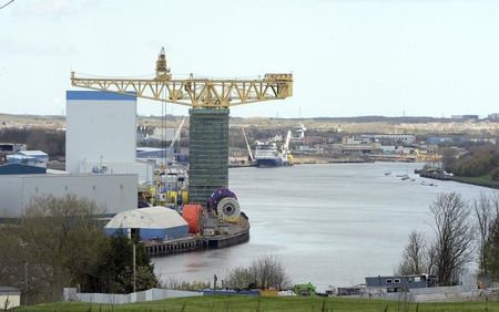 © Reuters. Crane is seen in an area of Industrial redevelopment on the river Tyne at Wallsend