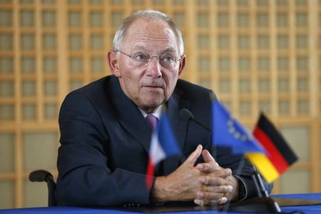 © Reuters. German Finance Minister Wolfgang Schaeuble attends a news conference at the Bercy Finance Ministry in Paris